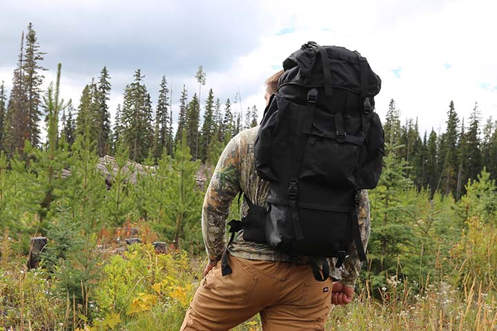 black outdoor backpack with internal metal frame molle